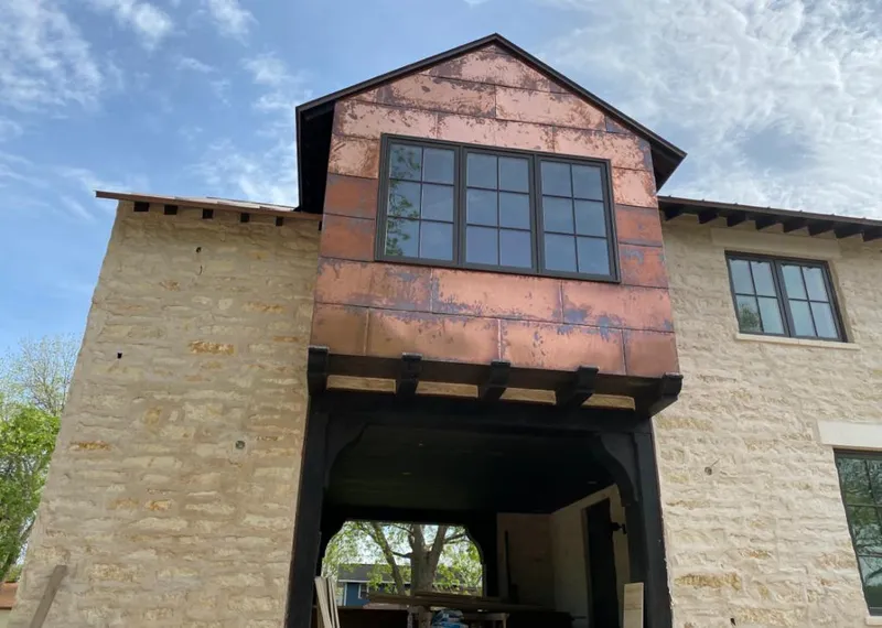 Copper metal panel facade on a stone building for Metal Roof Coating in Chula Vista